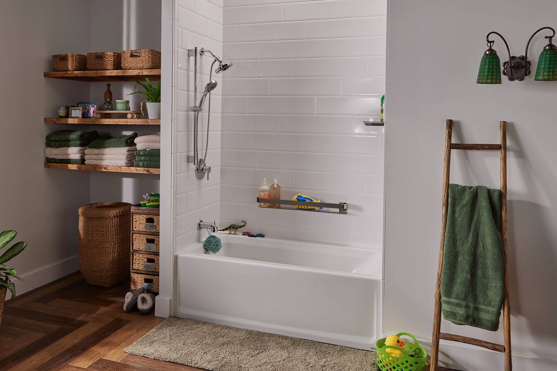 Cozy bathroom with a white tiled bathtub, wooden ladder towel rack, wicker storage baskets, and green towels. Warm, organized, and inviting atmosphere.