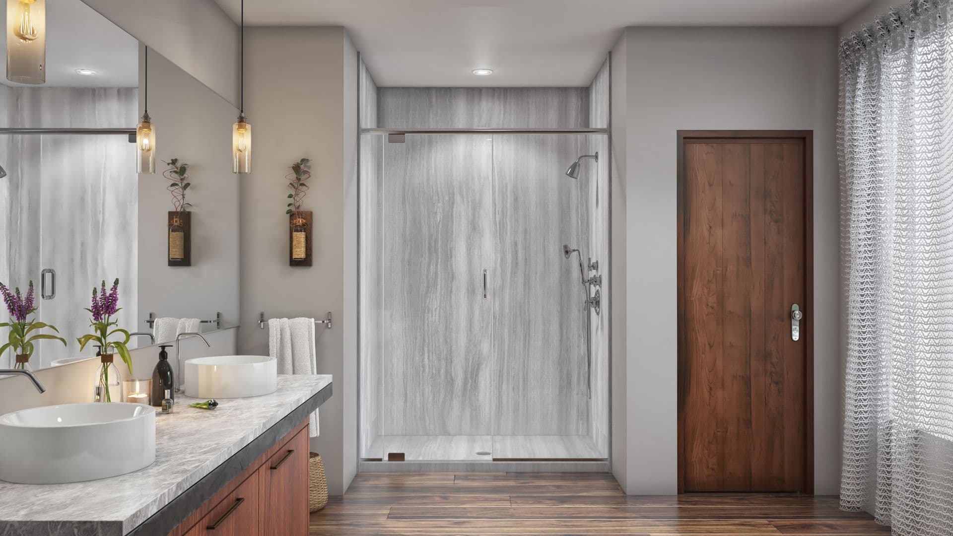 Elegant bathroom with a large walk-in shower featuring grey stone walls. Double sinks on a marble countertop. Warm lighting and wooden elements create a cozy vibe.
