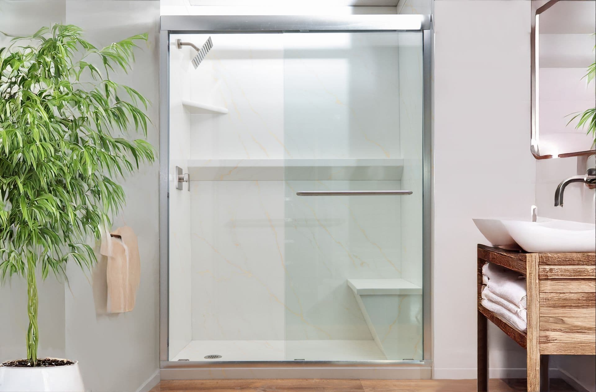 Modern bathroom with a glass shower, sleek fixtures, and a wooden vanity with a vessel sink. A green potted plant adds a refreshing touch.